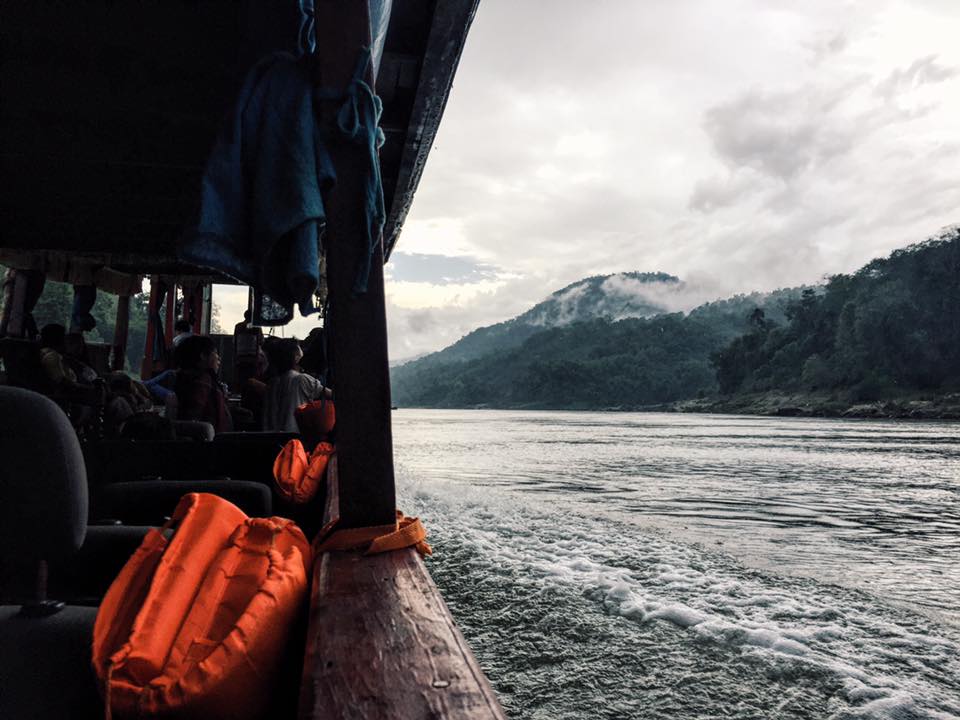The view from the side of the slow boat from laos to thailand looking down the mekong river