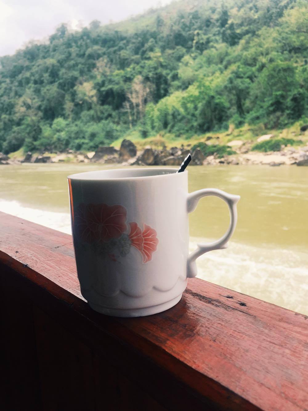 Coffee served in a mug onboard the slow boat from laos to thailand 