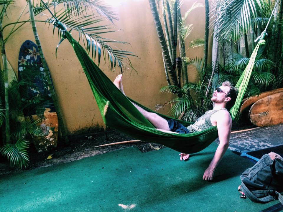 Phil lounging in the hammocks at one of the best hostels in Waikiki - Polynesian beac h club