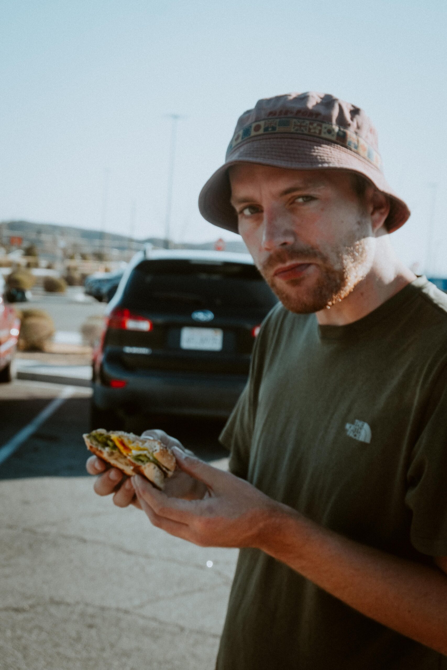 Phil eating an bagel in Joshua Tree National Park 