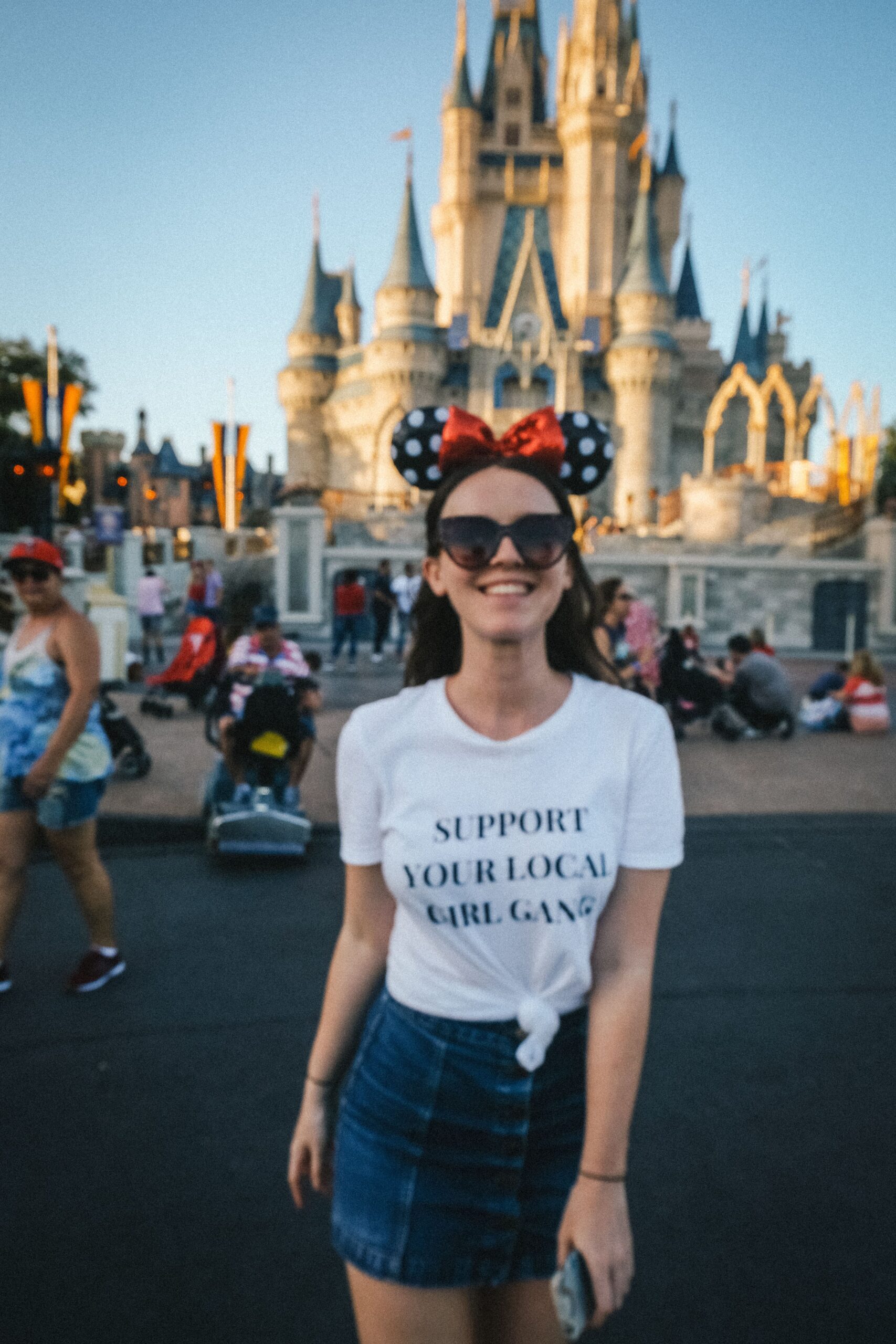 Holly in front of the Magic Kingdom Castle - Disney Hotels or International Drive