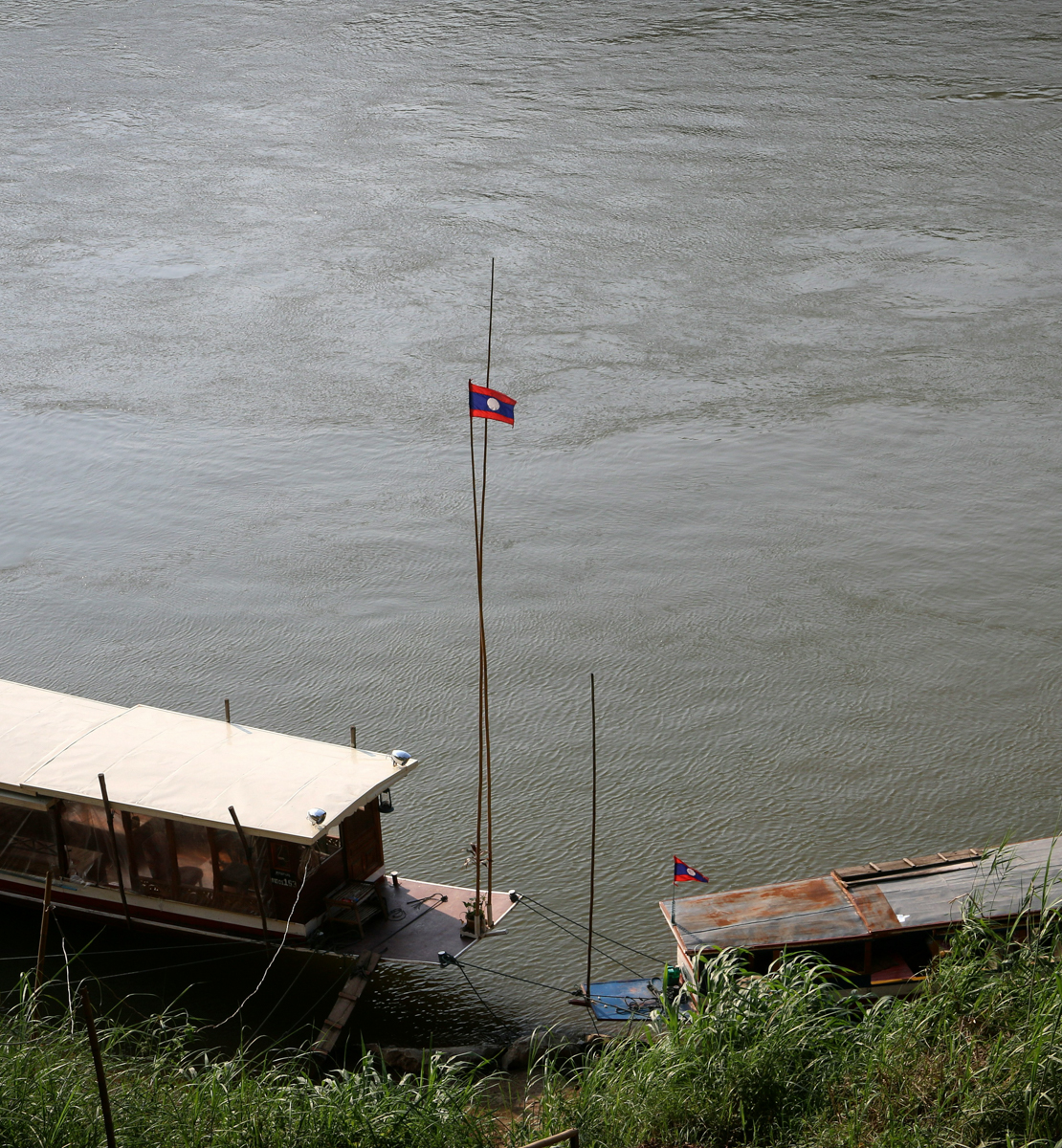 Laotian flag at the dock where you get the slow boat from Laos to Thailand 