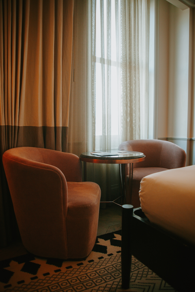 The table and chair setup in the cosy queen room