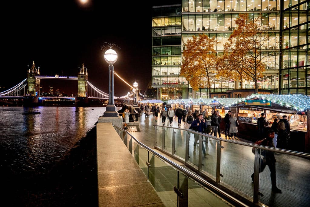 View of tower bridge from the winter by the river christmas market in London 